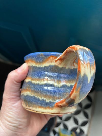 Good old Albany slip with stripes of indigo float on white clay by Chelsea Greene.