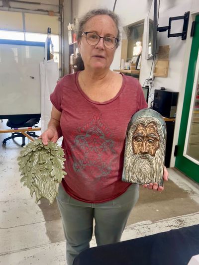 Sue is giving faces to her trees.
